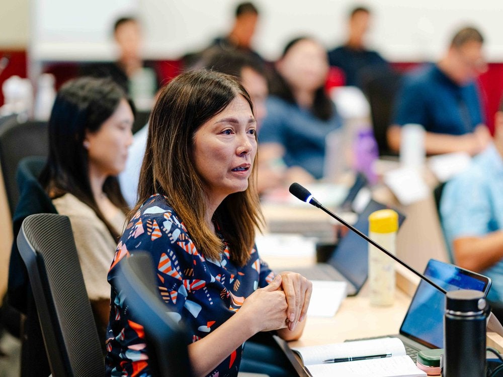 An executive education participant speaking during a session at the Lee Kuan Yew School of Public Policy