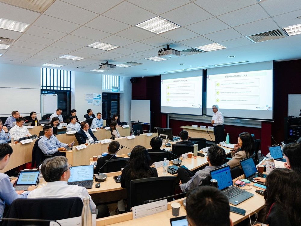 Faculty member leading a session for executive education participants at LKYSPP