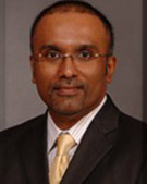 Dr Cherian George